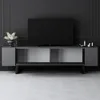 A modern media console with a TV and decorative items against a dark paneled wall and a light patterned floor. Voir les images du produit