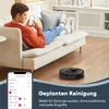 A man relaxing on a couch while controlling a robot vacuum cleaner via a smartphone app. Podgląd zdjęcia produktu