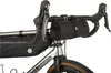 A close-up view of a bicycle's handlebars with accessories attached. Produktbild-Vorschau