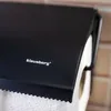A close-up shot of a black toilet paper holder with the brand name 'klausberg' visible. Produktbild-Vorschau