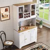A white and wood-grain sideboard with glass doors and wine storage, set in a dining or living room with a chair and a window view of a garden and pool. Produktbild-Vorschau
