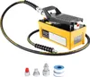 A yellow and black air-hydraulic foot pump with a hose and several accessories on a white background. Podgląd zdjęcia produktu
