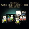 A collection of Sheba cat food products displayed against a dark, gradient background with promotional text at the top. Produktbild-Vorschau