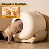 A cat is entering a modern, automated cat litter box in a home environment. Produktbild-Vorschau