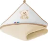 A folded hooded towel with a teddy bear embroidery and a brand label. Náhľad obrázku produktu