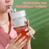 A person is drinking from a portable smoothie mixer. Produktbild-Vorschau