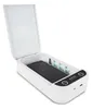 A white UV sterilizer box with a smartphone inside, lid open, showing the UV lights. Produktbild-Vorschau