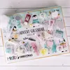 An advent calendar with various bath and body products displayed on a white wooden surface. Produktbild-Vorschau