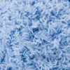 A close-up view of light blue yarn. Produktbild-Vorschau