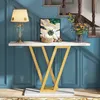 A console table with decorative items placed on it, set against a blue paneled wall and staircase. Náhľad obrázku produktu