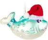 A glass Christmas ornament of a blue fish wearing a Santa hat. Produktbild-Vorschau