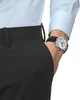 A close-up shot of a man's wrist wearing a watch, with his hand in his pocket. Anteprima dell’immagine prodotto