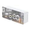 A white digital alarm clock with an LED display reflecting a room interior. Podgląd zdjęcia produktu