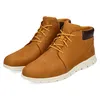 A pair of tan Timberland chukka boots with white soles, shown against a white background. Produktbild-Vorschau