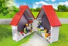 A toy veterinary clinic playset with figures and animals, set against a backdrop of a park and city skyline. Produktbild-Vorschau