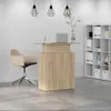 An office reception area with a desk, chair, and shelving unit. Podgląd zdjęcia produktu
