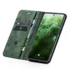 A green flip case for a smartphone is shown open, revealing credit cards and a banknote inside. The smartphone screen displays the time and date. Produktbild-Vorschau