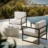 Outdoor lounge furniture set next to a swimming pool with palm trees in the background. Náhled obrázku produktu