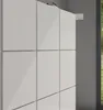 A white cabinet with a window showing greenery in the background. Produktbild-Vorschau