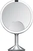 A close-up studio shot of a silver makeup mirror on a white background. Náhled obrázku produktu