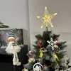 A decorated Christmas tree with a star topper and ornaments, next to a Christmas fairy doll. Náhľad obrázku produktu