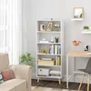 A white bookshelf with books and decorative items, placed in a living room setting next to a desk and chair. Náhľad obrázku produktu