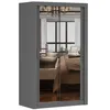 A gray wardrobe with mirrored doors reflecting a bedroom interior. Voir les images du produit