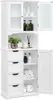 A white wooden cabinet with glass doors and drawers, containing various bathroom items. Produktbild-Vorschau