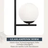 A close-up of a modern black floor lamp with a white glass globe shade, with text overlay describing its features. Anteprima dell’immagine prodotto