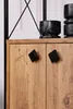A close-up of a wooden cabinet with two black diamond-shaped handles. There are black decorative objects on top of the cabinet. Produktbild-Vorschau