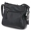 A black Rieker women's crossbody bag is shown from a side angle against a white background. Náhled obrázku produktu