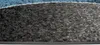 A close-up view of a rug with a textured pattern in shades of gray, black, and blue. Náhľad obrázku produktu