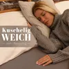 A woman sleeping comfortably in a bed, with text overlay promoting the product. Produktbild-Vorschau