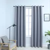 A room interior with a window covered by gray curtains, a chair, and a floor lamp. Náhled obrázku produktu