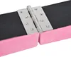A close-up shot of a stainless steel hinge attached to a pink balance beam covered in black fabric. Produktbild-Vorschau