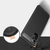 A black phone case with a carbon fiber texture is shown at an angle, with a close-up inset highlighting its protective features. Produktbild-Vorschau
