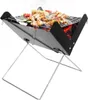 A portable charcoal grill with food cooking on it. Náhled obrázku produktu