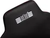 A close-up view of a black racing seat with red stitching and a white embroidered logo. Produktbild-Vorschau