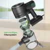 A cutaway view of a black and transparent cordless vacuum cleaner, illustrating its multi-stage filtration system with green leaves and light effects. Podgląd zdjęcia produktu