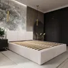 A bedroom with a bed, wardrobe, and decorative elements. Náhľad obrázku produktu