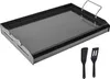 A black steel griddle plate with two black spatulas on a white background. Produktbild-Vorschau