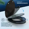 A black toilet seat with its lid open, demonstrating its soft-close feature. Anteprima dell’immagine prodotto