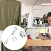 A sewing machine light is shown in a circle on the left, while the background shows a sewing workshop with a person working at a sewing machine. Podgląd zdjęcia produktu