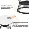 A close-up of a marble-patterned tabletop being wiped clean, with a detail of the table's black metal base. Produktbild-Vorschau