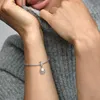 A close-up shot of a person's arm wearing a Pandora bracelet with a charm. Anteprima dell’immagine prodotto