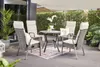 An outdoor patio set with chairs and a table, surrounded by plants and a hedge. Produktbild-Vorschau