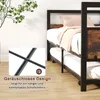 A bunk bed with a pull-out trundle bed is shown in a room with a plant in the background. A close-up inset shows a detail of the bed frame with a sound icon. Náhled obrázku produktu