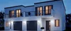 A modern, two-story building with a white facade, featuring multiple garage doors on the ground floor and balconies on the upper level. The exterior lights are on, illuminating the building against a twilight sky. Anteprima dell’immagine prodotto