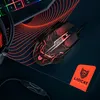 A gaming mouse and keyboard on a mousepad with a red, wavy design. Podgląd zdjęcia produktu