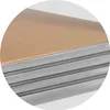 A close-up view of stacked shelves, showing the texture of the material and the metallic edges. Produktbild-Vorschau